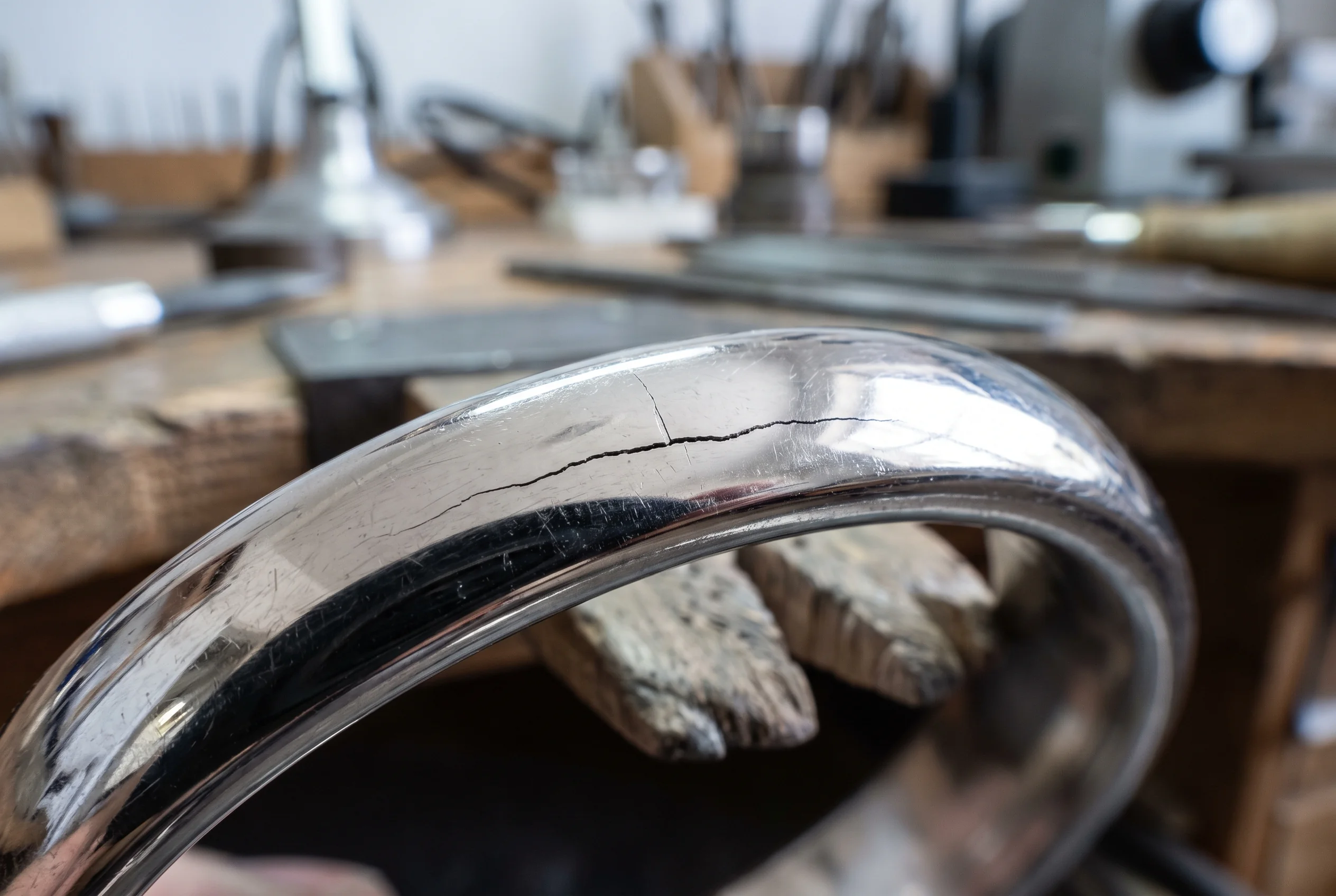 Macro of a hairline crack running across a polished band